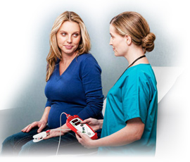 Nurse checking patient with Masimo Pronto